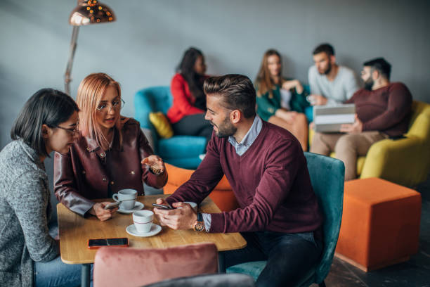 istock Group of friends sitting in cafe 1148215469