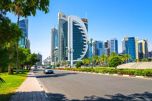 Doha, Qatar - Modern skyscrapers in the business district with meadow of a park