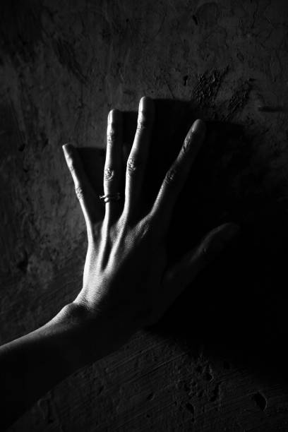 istock Black and white image of a womans hand 1148216359