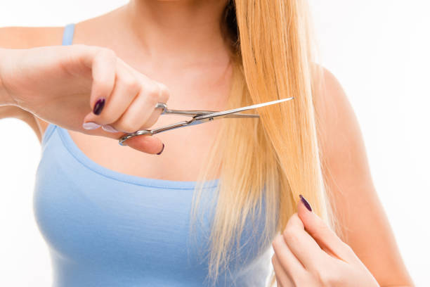 istock Woman cut her hair. Problem of split ends 1148216903