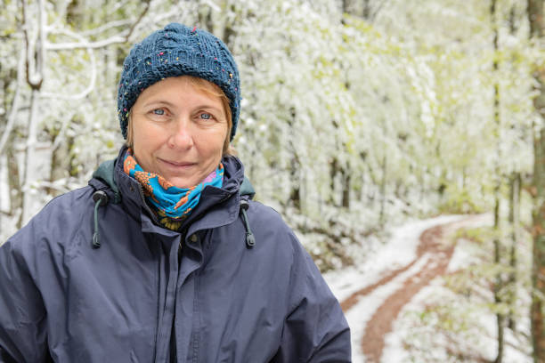 Portrait of a mature woman in winter idyll, Primorska, Julian Alps, Slovenia, Europe Portrait of a mature woman in winter idyll, Primorska, Julian Alps, Slovenia, Europe,Nikon D850 primorska white sport nature stock pictures, royalty-free photos & images