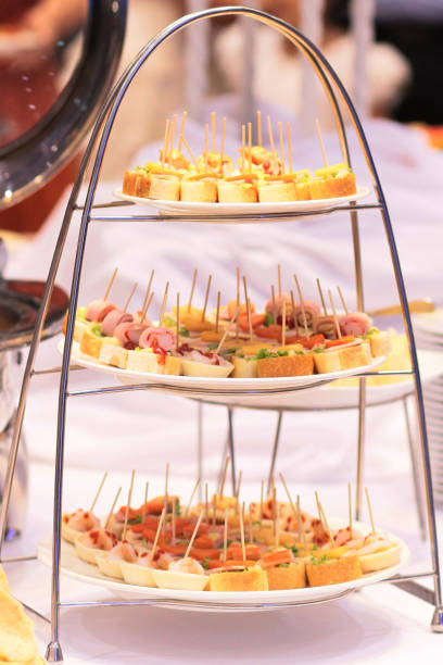 istock Delicious Buffet dessert set with cheese, meat, rolls, tortilla and fruit salad.  dessert table, cake, pie in weddig day 1148218562
