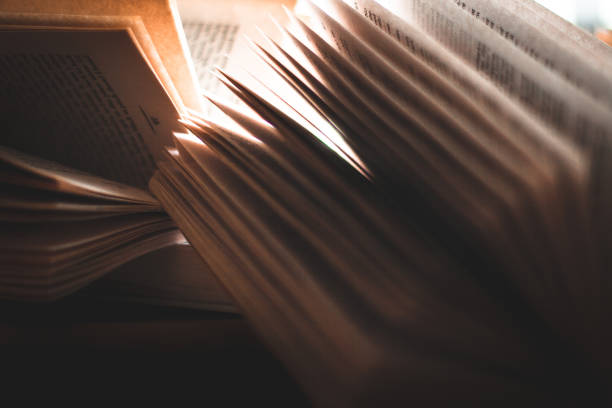 istock flipping pages of an open book 1148219995