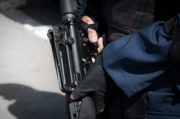 istock Soldier holding a machine with automatic gun.Preparation for military action 1148221010
