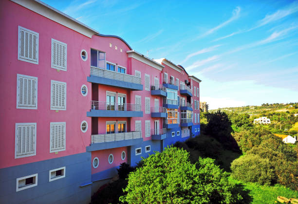 istock View of pink modern house throug the window frame 1148223667