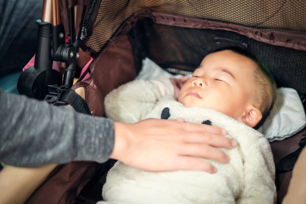 istock Baby sleeping with parents in metro train 1148223680