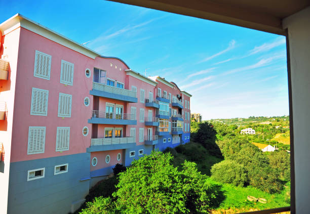 istock View of pink modern house throug the window frame 1148223691