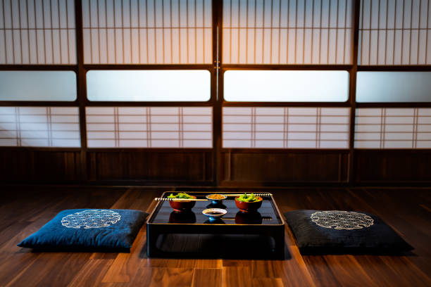 Traditional japanese machiya house or ryokan restaurant with black lacquered wood table and edamame soybeans food with natto and soy sauce Traditional japanese machiya house or ryokan restaurant with black lacquered wood table and edamame soybeans food with natto and soy sauce washoku stock pictures, royalty-free photos & images