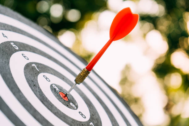 Target dart and arrow with abstract nature bokeh blur background