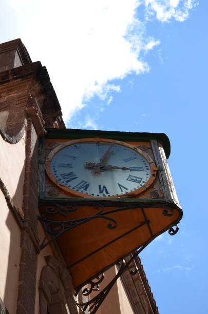 istock Old watch on a church facade in Bosa 1148225711