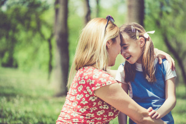 istock Mother and daughter together in nature 1148226843