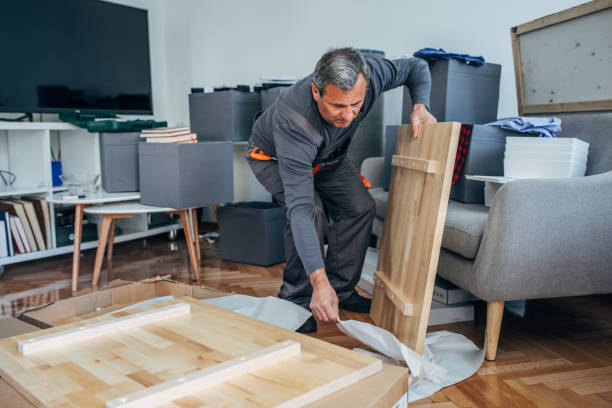 istock Senior man assembling wooden furniture 1148228041