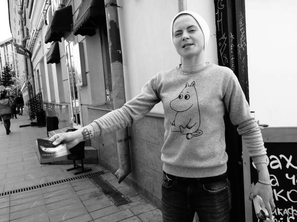 Moscow, Russia - May 10, 2019: a promote maid is handing out flyers in Solyanka street