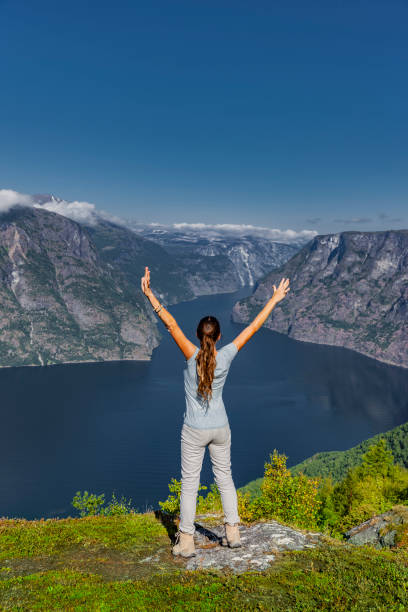 istock Happy Woman moving at Aurlandsfjord 1148228607
