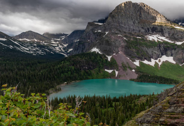 istock Grinnell Lake Surrounded by Green Trees 1148231248
