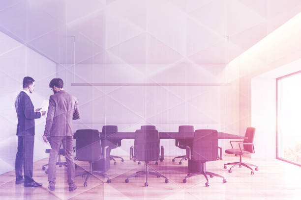 istock Businessmen in minimalistic conference room 1148231403