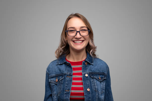 Cheerful young woman in glasses