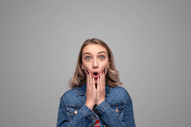 istock Shocked teenager touching cheeks 1148231415