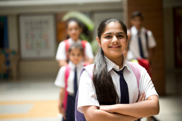 istock School girl with arms crossed 1148232105