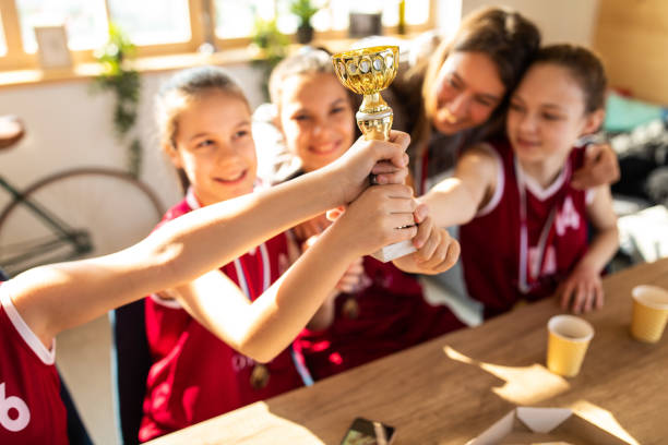 istock Celebrating winning a trophy with coach 1148232318