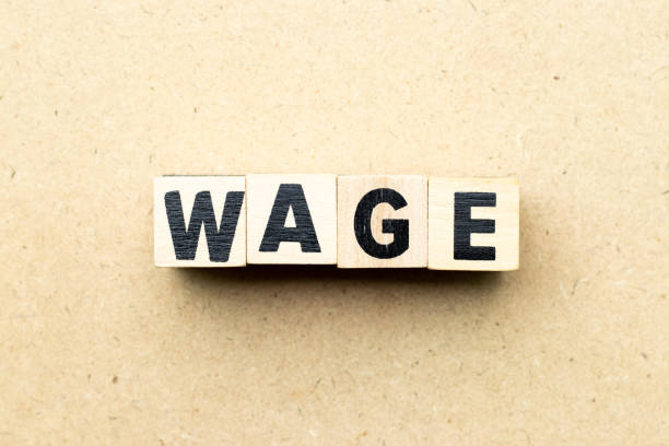istock Letter block in word wage on wood background 1148232838