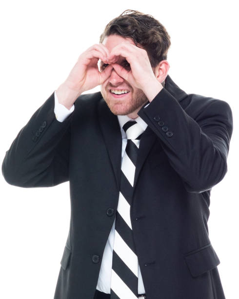 istock One good looking young businessman wearing a suit - binoculars 1148234917