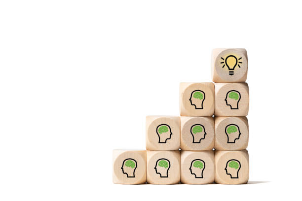many people together having an idea symbolized by icons on cubes many people together having an idea symbolized by icons on cubes on white background concepts topics stock pictures, royalty-free photos & images