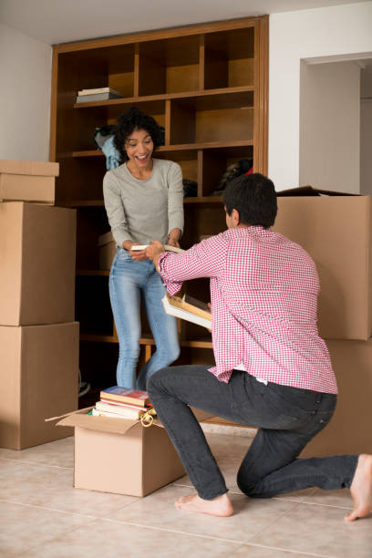 istock Couple packing to move house 1148236283
