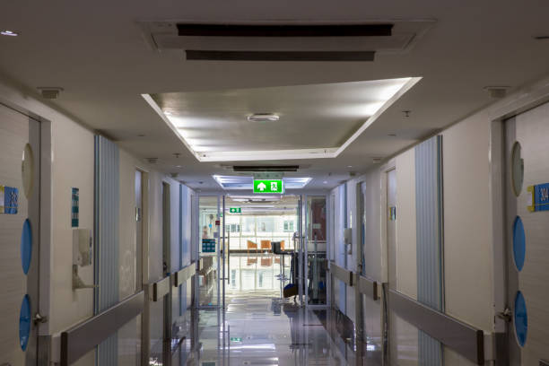istock Green emergency exit sign showing the way to escape.Fire exit in the building. 1148243952