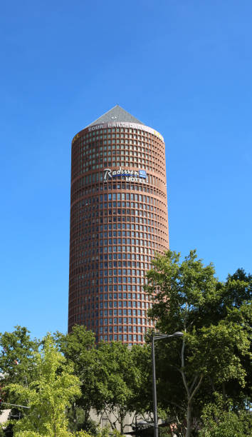 Lyon, France - August 16, 2018: Modern high skyscraper called Part-Dieu Tower and the name of Hotel Radisson Blu and blue sky in background