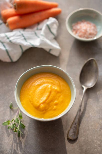 istock Vegetarian Velvety Pureed Carrot Soup with fresh sage 1148244954