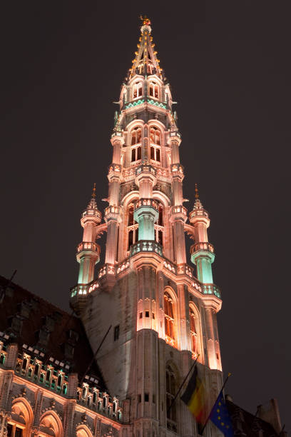 A view of the magnificent Brussels Town Hall illuminated at night, located in the historic Grand Place in the city of Brussels, Belgium.