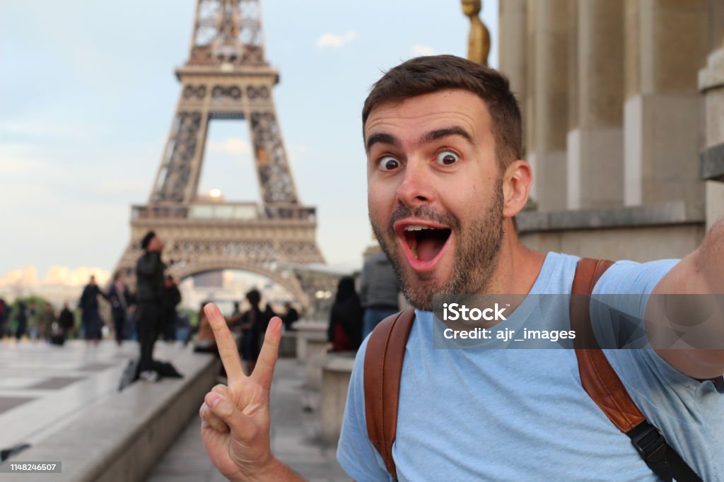 Ecstatic man taking a selfie in the Eiffel Tower, Paris Ecstatic man taking a selfie in the Eiffel Tower, Paris. Selfie Stock Photo