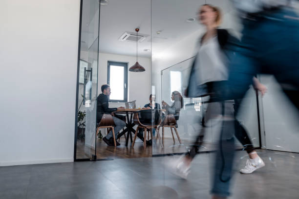 istock Business colleagues walking in the office 1148248868