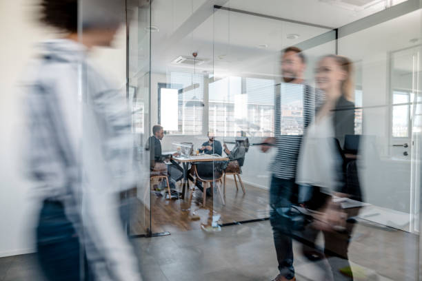 istock Business colleagues walking in the office 1148248869
