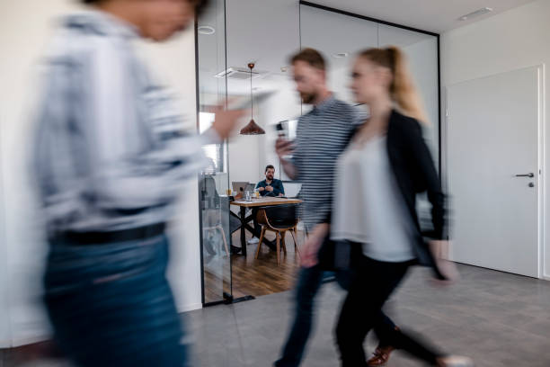 istock Business colleagues walking in the office 1148248874