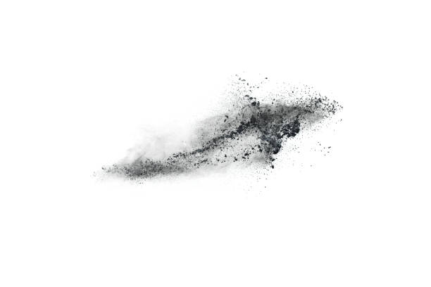 istock Black powder explosion. Closeup of black dust particles explode isolated on white background. 1148249150