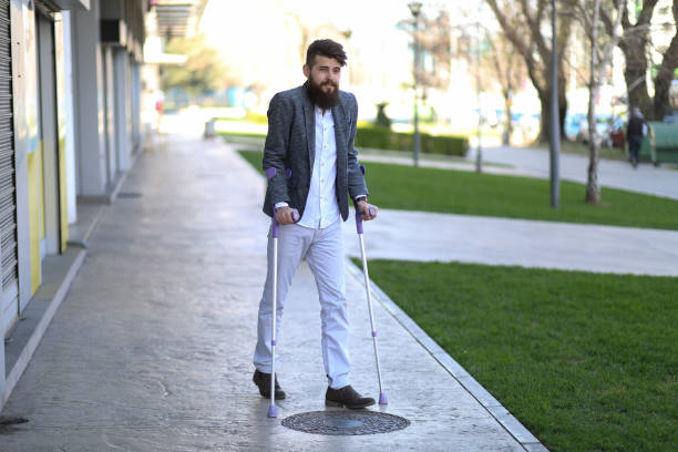 istock Young beautiful bearded man with walking sticks on the stree 1148251887