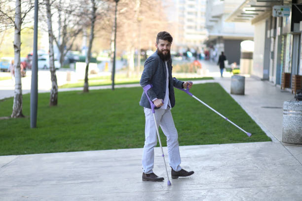 istock Young beautiful bearded man with walking sticks on the stree 1148252642