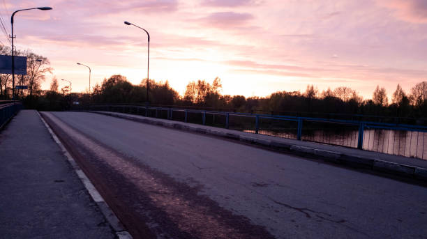 istock Bridge car at sunset. Road bridge in the evening. 1148255374