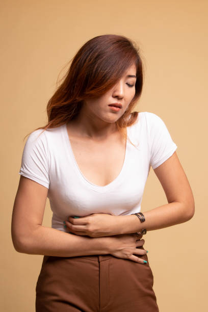 istock Young Asian woman got stomachache. 1148256140