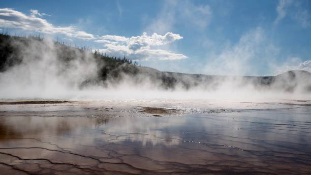 istock Steam and Reflection at Hot Spring in Yellowstone 1148257432