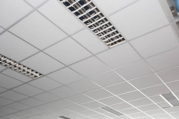istock Suspended ceiling with LED square lamps sin the office 1148257992