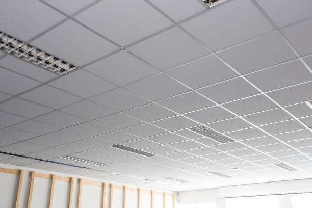 Suspended ceiling with LED square lamps sin the office stock photo