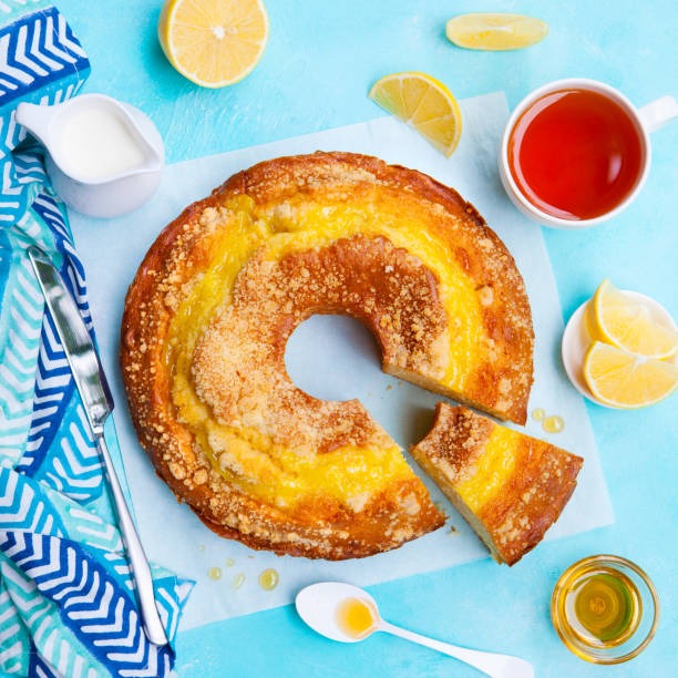istock Lemon cake with cup of tea. Blue background. Top view. 1148258798