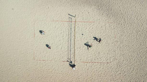 beach volleyball top view. sports and beach sports. photographed from the drone. aero photo filming - volleying sport summer men imagens e fotografias de stock