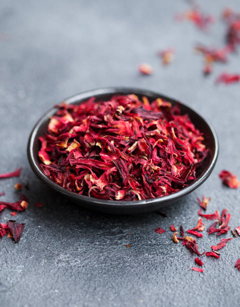 istock Hibiscus tea in black bowl. Slate background. Copy space. 1148259198