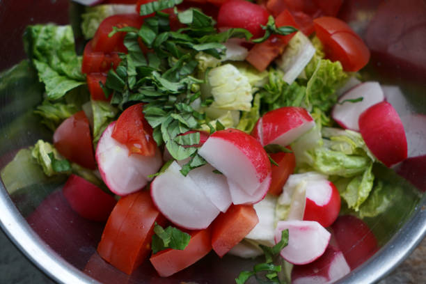 This is fresh salad served in different variations in bowls on the tray