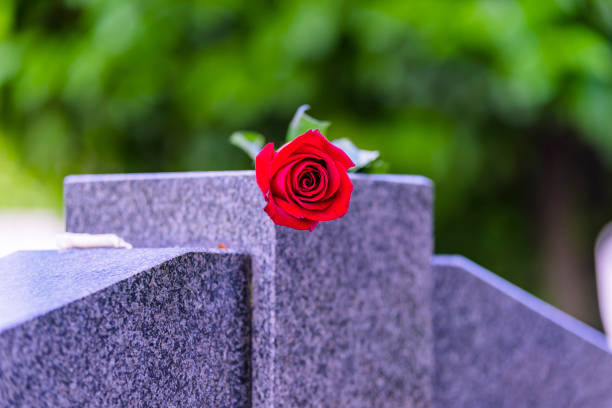 istock Flower On A Grave In A Cemetery 1148260038