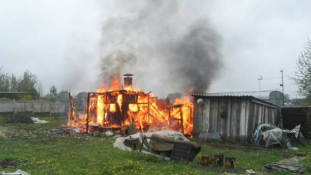 istock Old wooden building in flames 1148260713